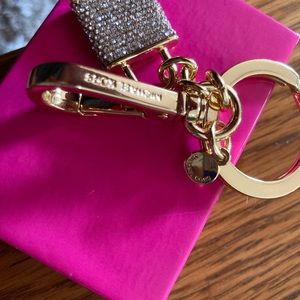 Michael Korrs pouch with Michael Kors purse charm